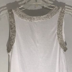 Women’s beaded cream top with button back detail